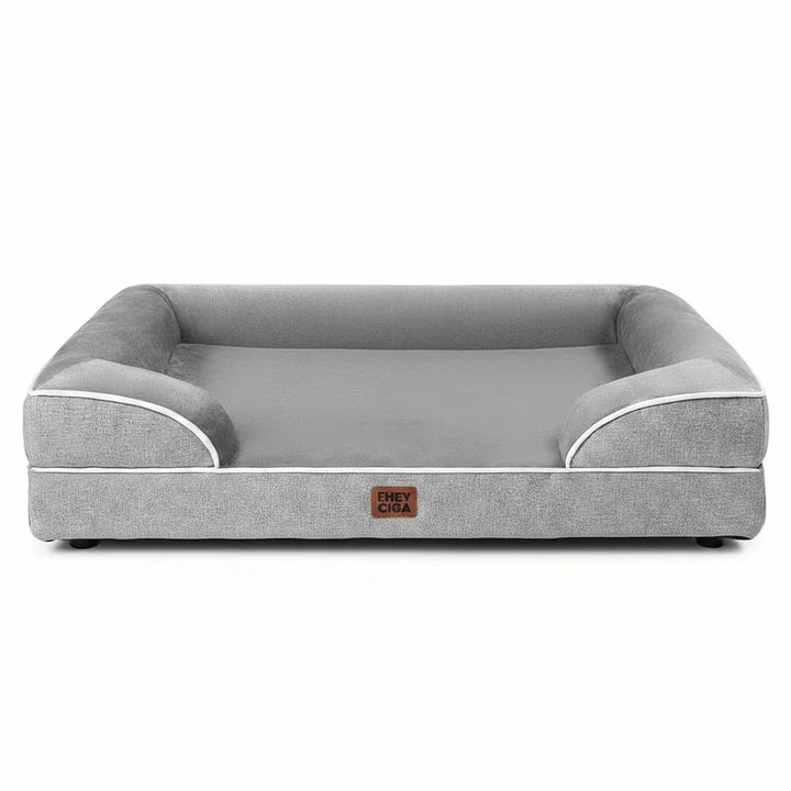 Gray dog bed with white trim and supportive sides for comfortable pet resting