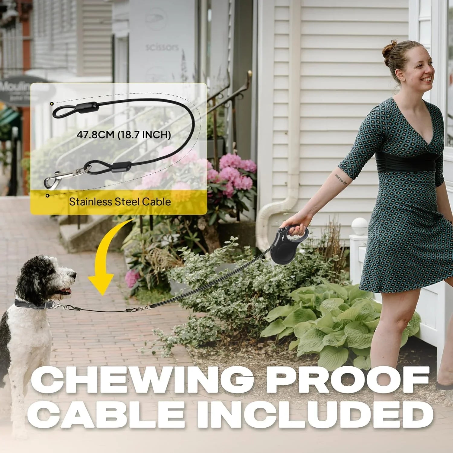 woman-walking-dog-with-chewing-proof-stainless-steel-cable-leash-on-sidewalk